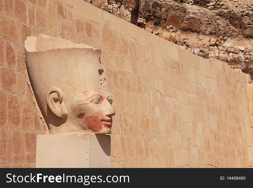 The ancient stone pharaoh's head in Egyptian temple