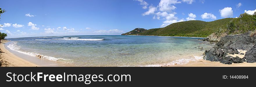 Panorama Island beach scene blue sky and water. Panorama Island beach scene blue sky and water