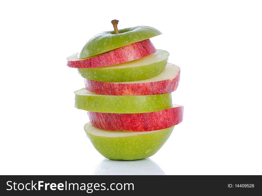 Photograph showing red and green apple slices isolated. Photograph showing red and green apple slices isolated