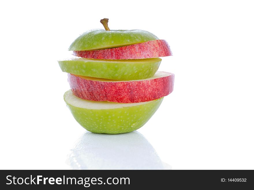 Photograph showing red and green apple slices isolated. Photograph showing red and green apple slices isolated