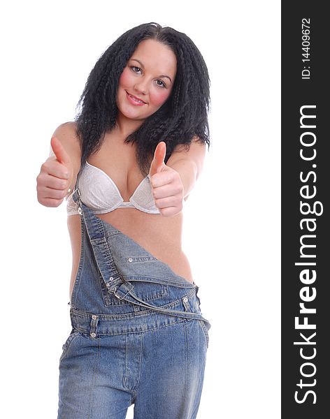 Pretty girl in bra and dungarees thumbs up