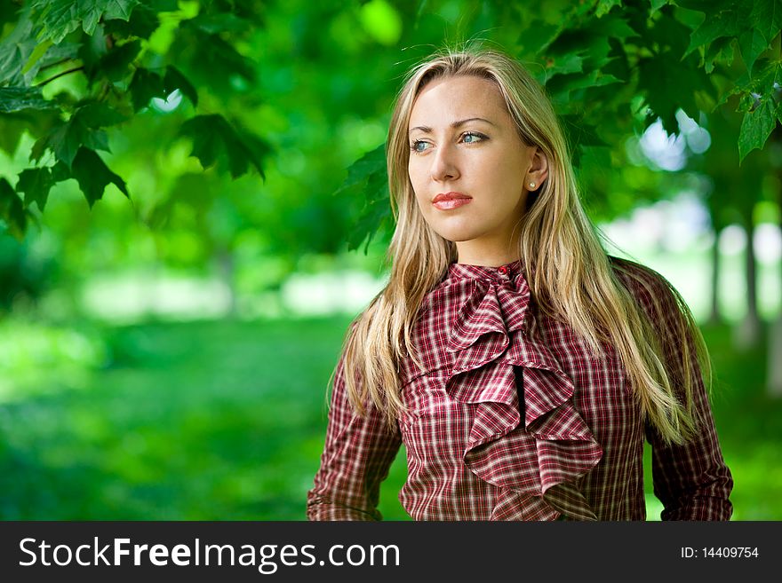 Beautiful blond girl relaxing outdoors