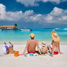 Family With Three Year Old Boy On Beach Royalty Free Stock Photos