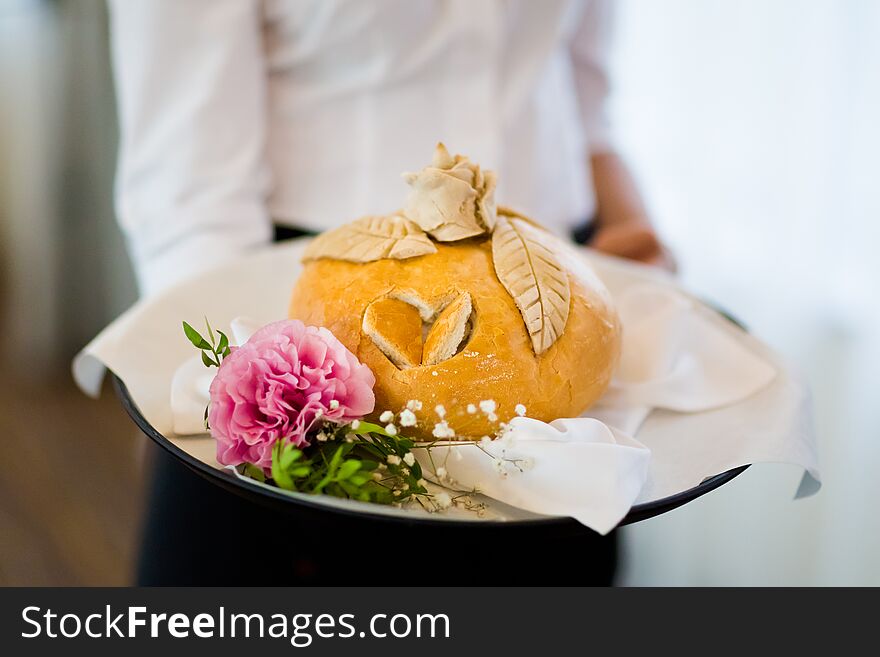 Wedding bread with salt detail on hands- traditional polish inviting to Bride and Groom. Wedding bread with salt detail on hands- traditional polish inviting to Bride and Groom