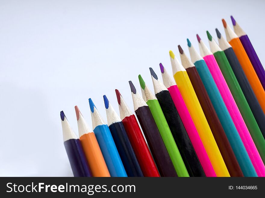 Color pencils on a white background, a line of colored pencils. Set of pencils. Children`s creativity. Drawing with pencils.