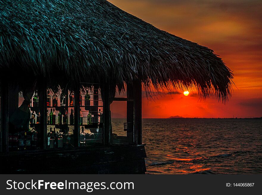 Grand sunset in a small harbor located next to a hotel on the Caribbean coast. Grand sunset in a small harbor located next to a hotel on the Caribbean coast