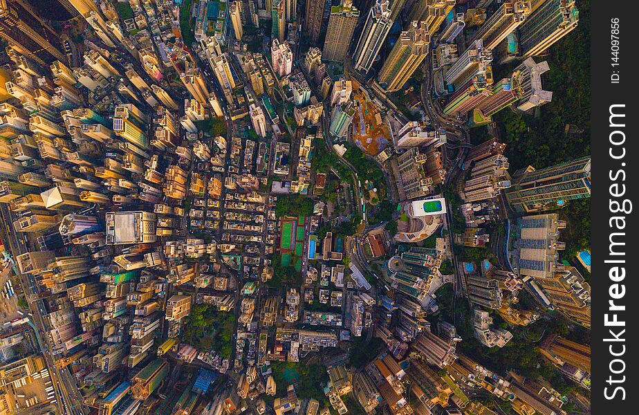 Aerial view of Hong Kong Downtown, China. Financial district and business centers in smart city in Asia. Top view of skyscraper and high-rise buildings at sunset. Top view