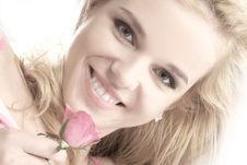 Portrait Of A Young Blond Holding A Pink Rose Royalty Free Stock Images Portrait Of A Young Blond Holding A Pink Rose Royalty Free Stock Images