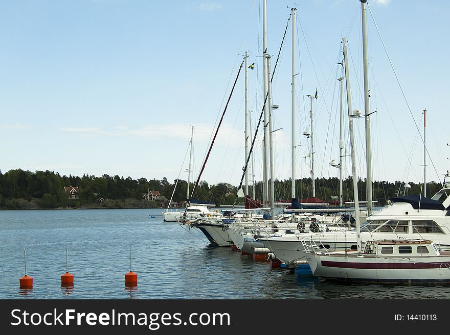 Quay with many boats anchored to the right