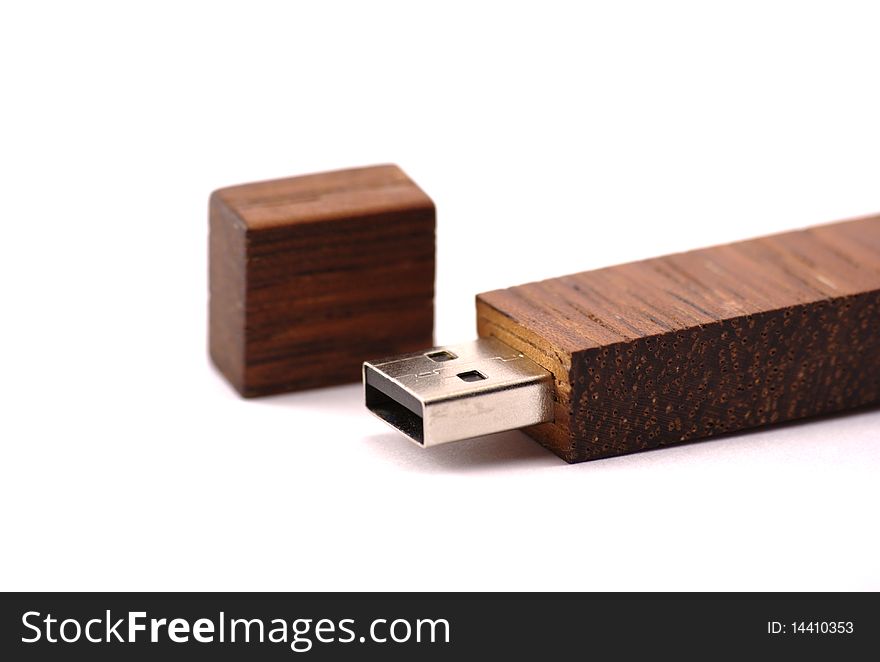 Dark brown wooden flash memory stick isolated on white background. Dark brown wooden flash memory stick isolated on white background