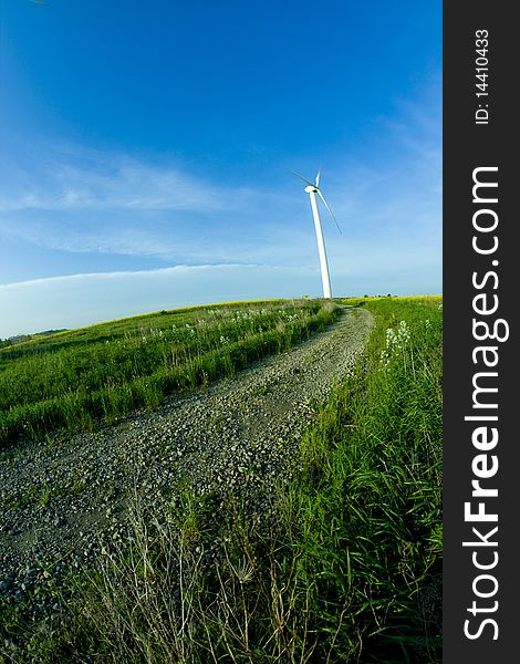 Wind turbine on the meadow shown by fisheye lens. Wind turbine on the meadow shown by fisheye lens
