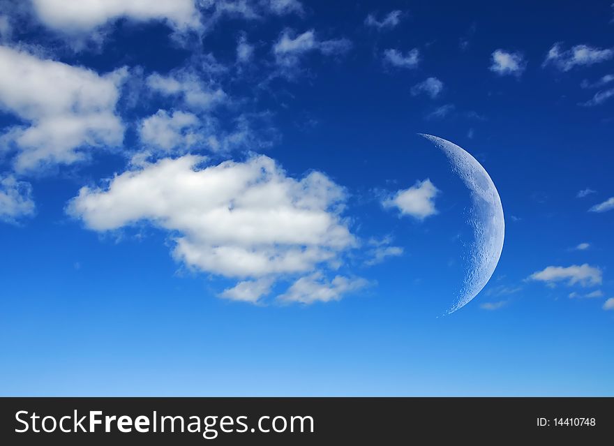 The satellite of our planet - the moon in a blue sky
