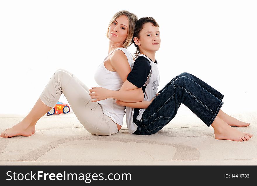 Mother and son sitting next to each other