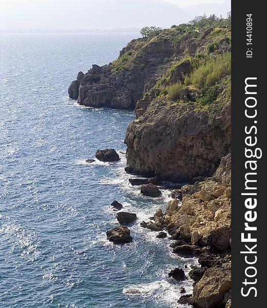 Cliffs and the sea and dark blue water