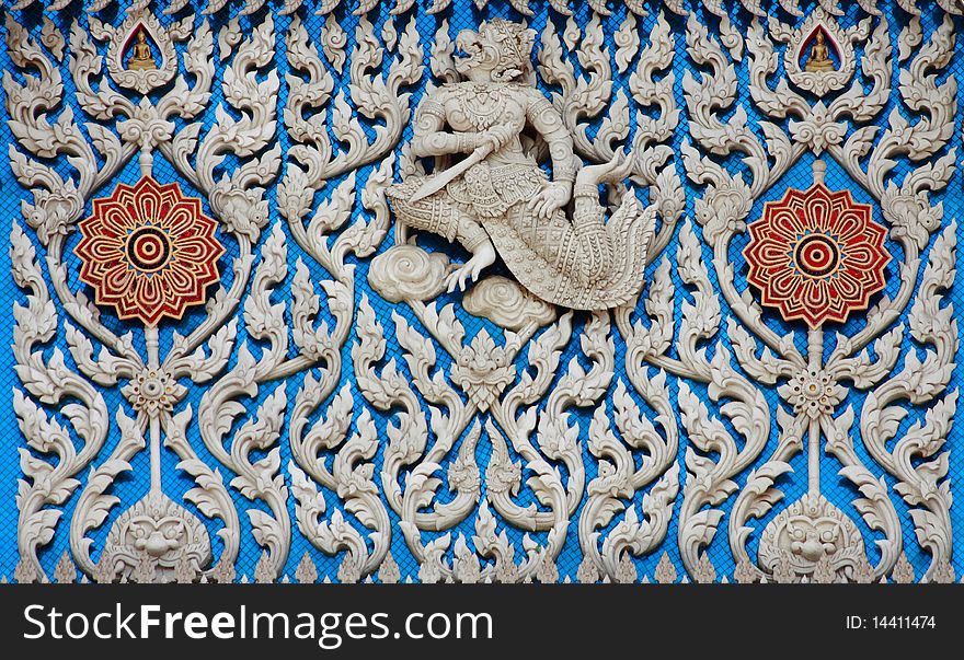 Traditional Thai style molding art with blue glass