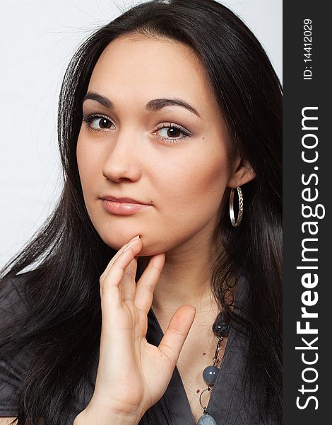 Studio portrait of beautiful girl with ear ring