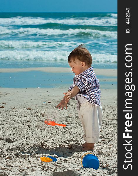 Child playing on a beach. Child playing on a beach