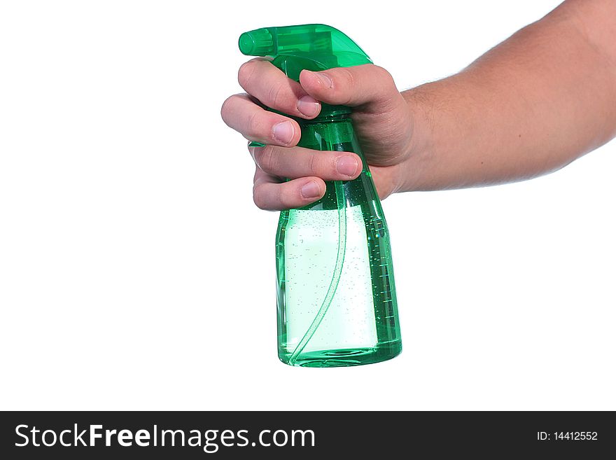 The man's hand holds a spray for water dispersion.