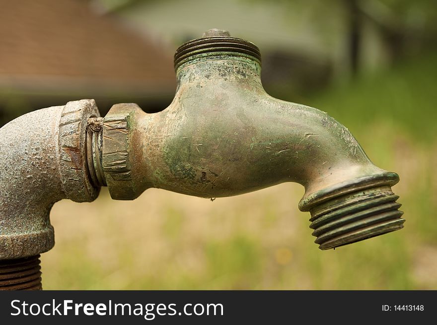 A rust pipe and spigot outside of my 101 year old home. A rust pipe and spigot outside of my 101 year old home.