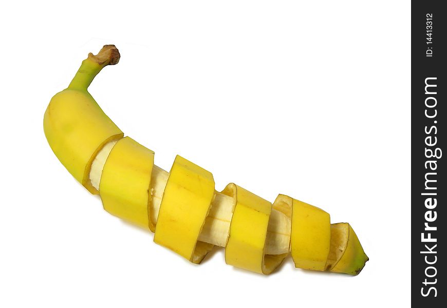 Banana with the peel as a spiral isolated on a white background. Banana with the peel as a spiral isolated on a white background