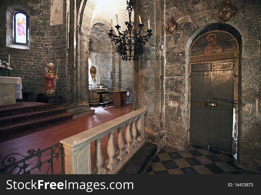 Facade and bell tower of an ancient medieval church outside. Facade and bell tower of an ancient medieval church outside