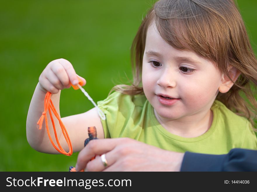 Little girl holding a bubble wand. Little girl holding a bubble wand