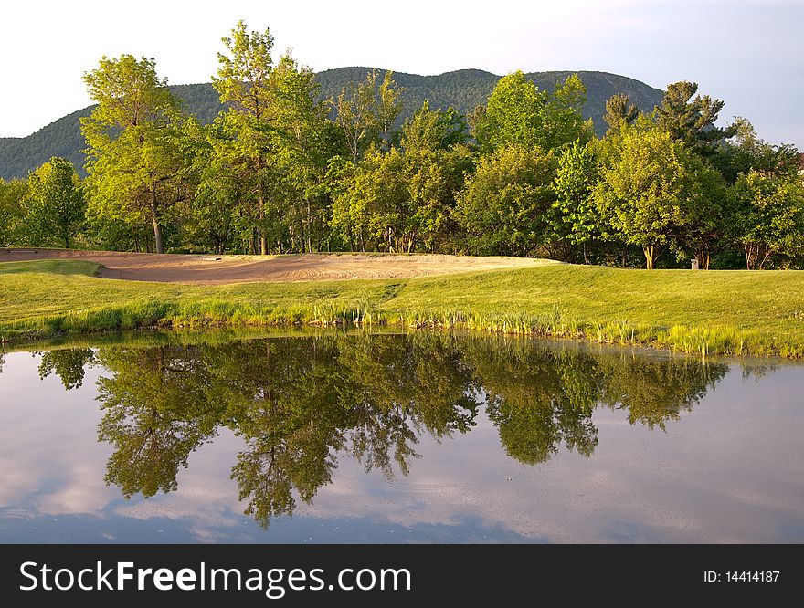 Beautiful golf course with focus on a sandtrap. Beautiful golf course with focus on a sandtrap