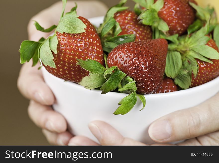 A white bowl of sweet strawberries. A white bowl of sweet strawberries