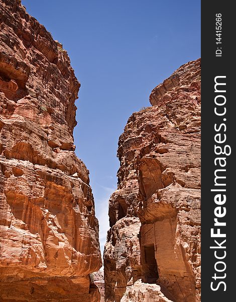 The Siq, the narrow slot-canyon that serves as the entrance passage to the hidden city of Petra, Jordan