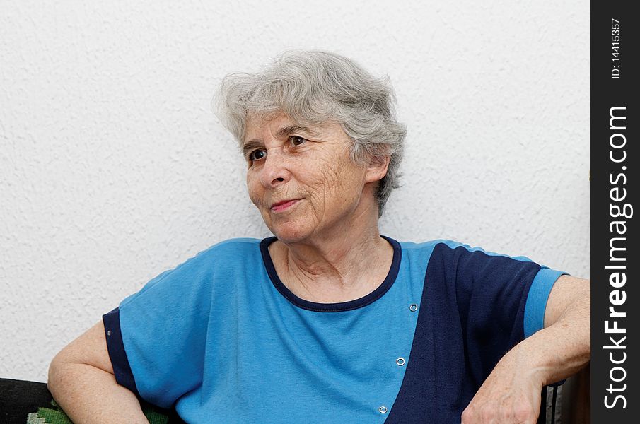 Relaxed elderly woman resting indoor