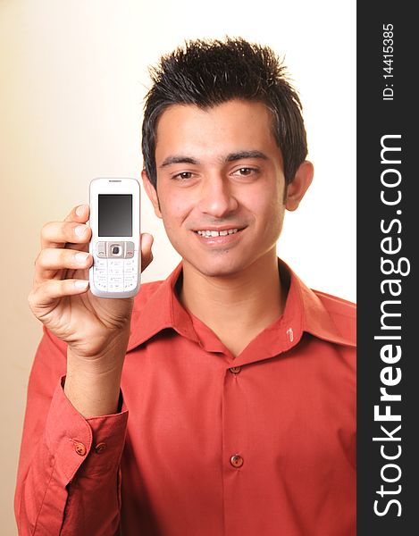 Happy Young Businessman showing his cell phone display-focus on cell phone.