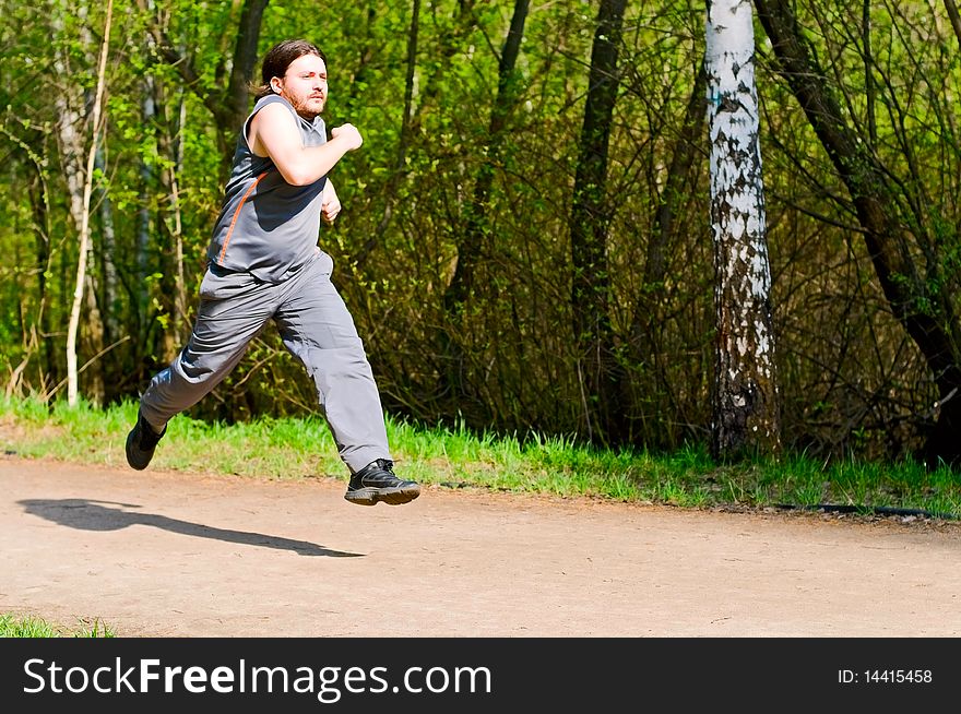 Young man running in the park. Young man running in the park