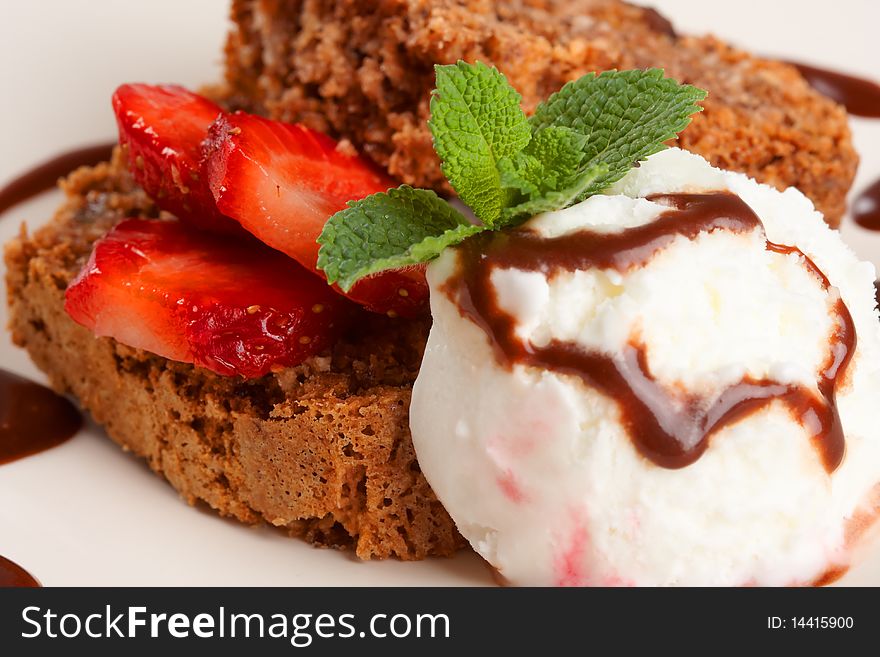 Slice of chocolate cake with fruits and ice cream. Slice of chocolate cake with fruits and ice cream