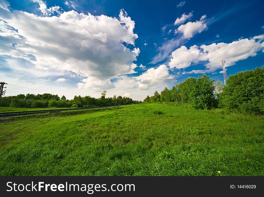 Blue sky with clouds and the green field. Blue sky with clouds and the green field