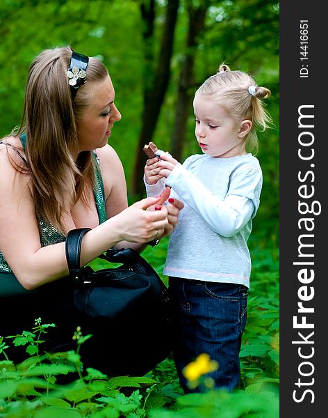 Mother and daughter in park. Outdoor shot. Mother and daughter in park. Outdoor shot