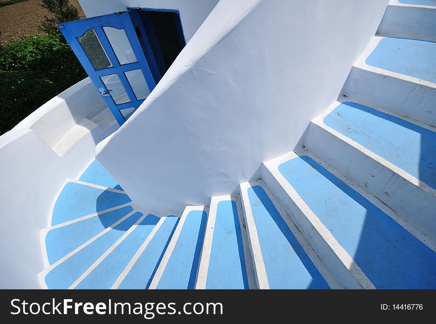 It is a gyrate stair on blue and white