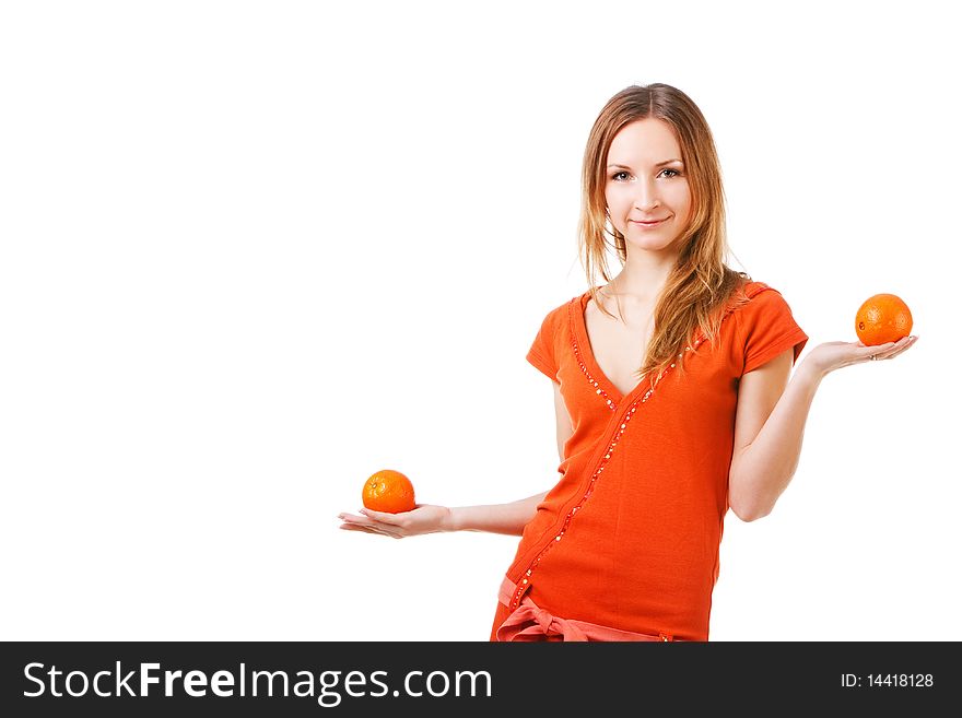 Picture of a young pretty girl in dress which holds oranges. Isolated on white. Picture of a young pretty girl in dress which holds oranges. Isolated on white.