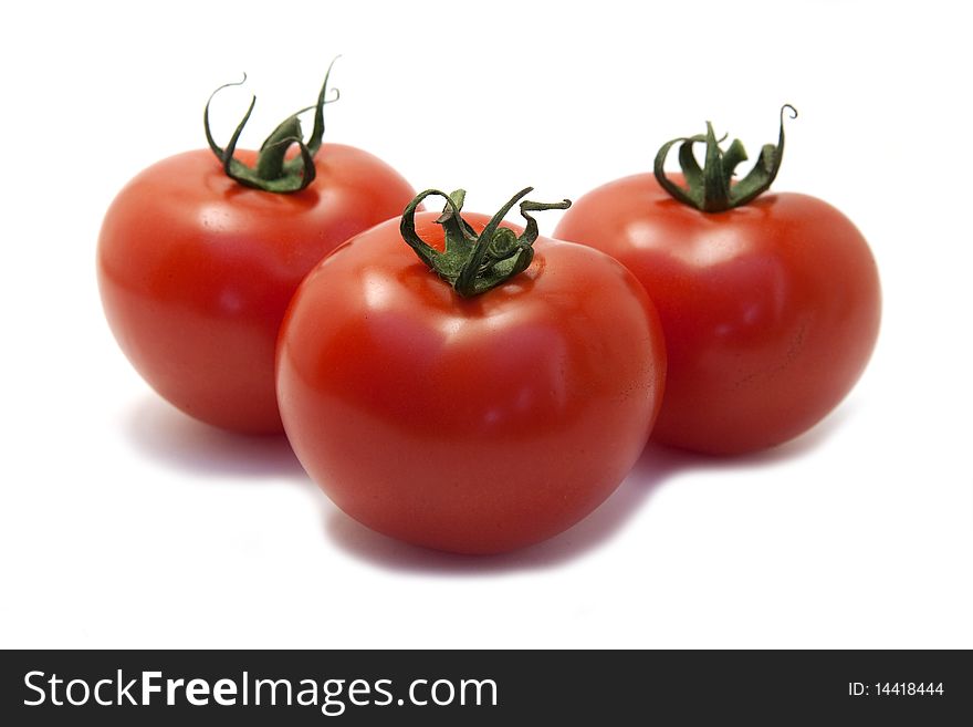 Three red tomato isolated on white
