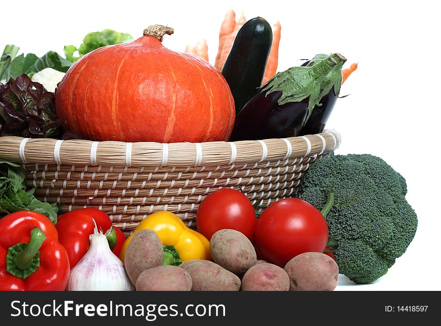 Assorted Vegetables in a basket isolated on a white backgorund
