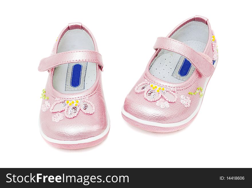 Pink shoes for baby girls isolated on white