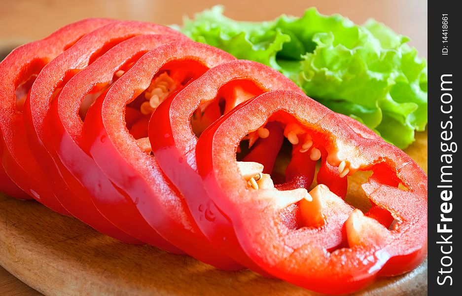 Shows a red pepper chopped rings, close-up