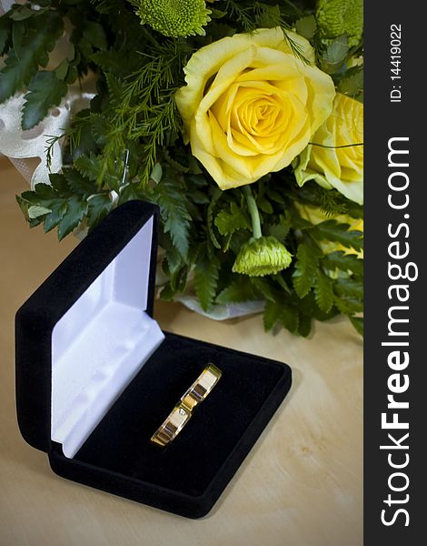 Wedding rings and yellow roses. Wedding rings and yellow roses