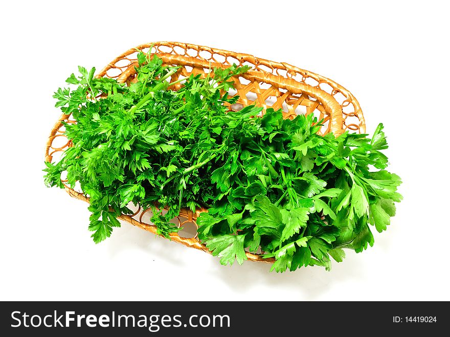 Image of fresh parsley in a basket on a white background