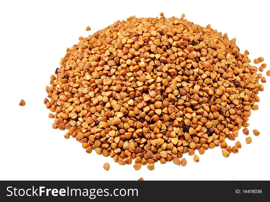 Image of a handful of buckwheat isolated on a white background