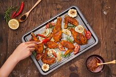 Grilled Chicken Drumstick And Wings On Baking Tray Over Wooden Table Royalty Free Stock Photo Grilled Chicken Drumstick And Wings On Baking Tray Over Wooden Table Royalty Free Stock Photo