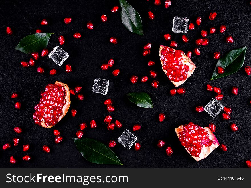 Ripe Pomegranate Fruits On The Wooden Background