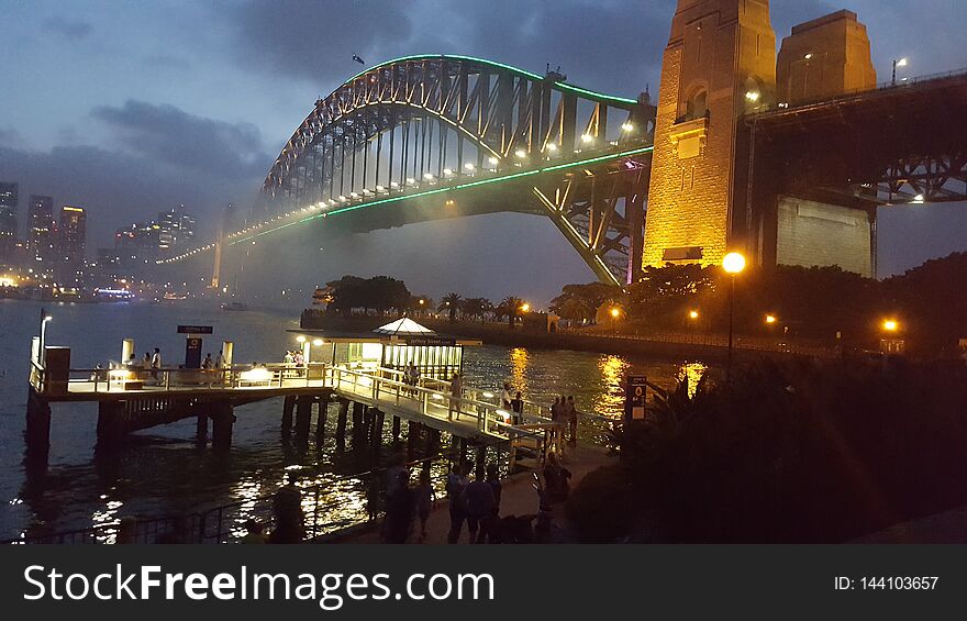 Twilight On Sydney Harbour Bridge On The Sparkling And Pristine Waters Of Sydney Harbour In Sydney, NSW, Australia