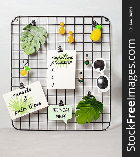 Wire grid board with girl's accessories and cards for inspirational quotes