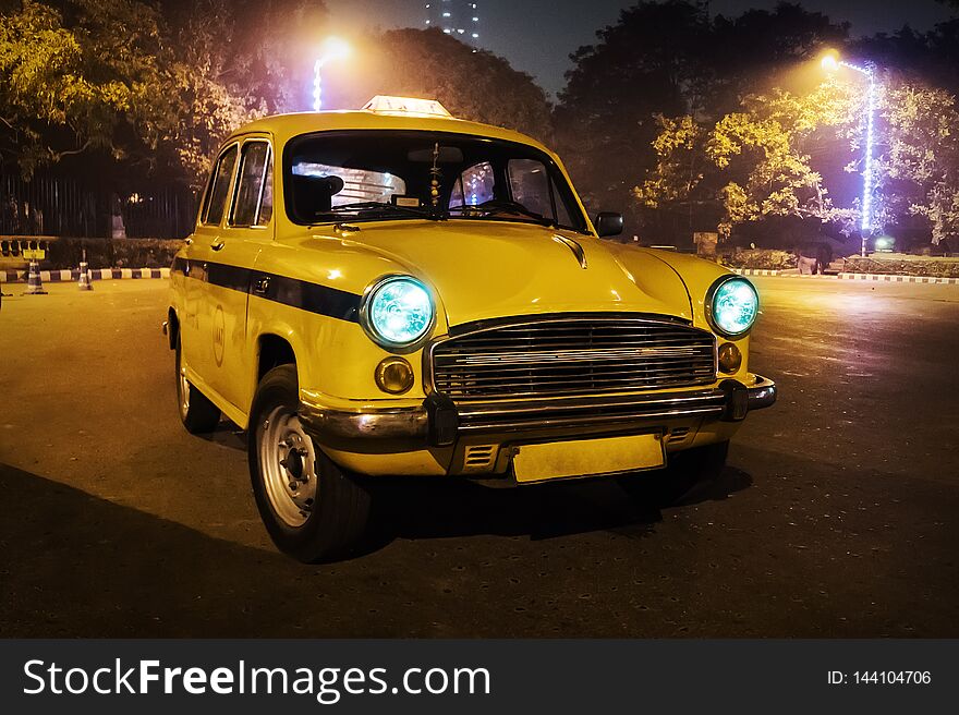 A yellow taxi. Old retro car in the form of a city taxi