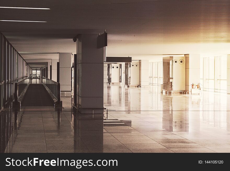 interior of the modern architectural in shanghai airport. Empty airport building. bright light from a panoramic window